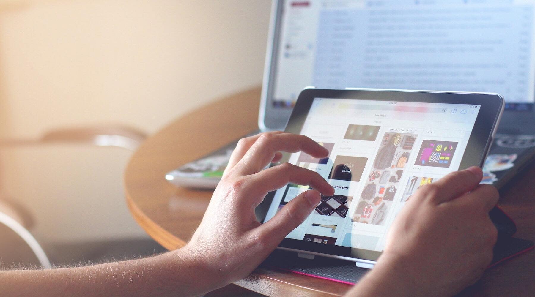 A person touches a digital tablet